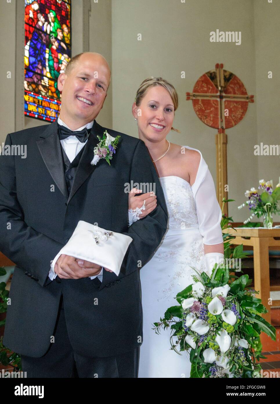 Good-humoured bridal couple on the day of the wedding Stock Photo