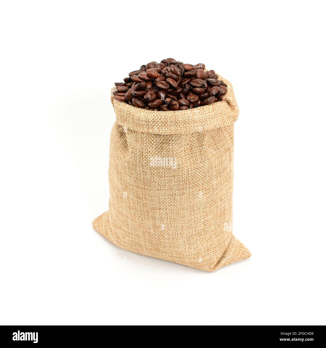 Coffee beans. Hard roasted coffee beans in jute burlap sack. Isolated