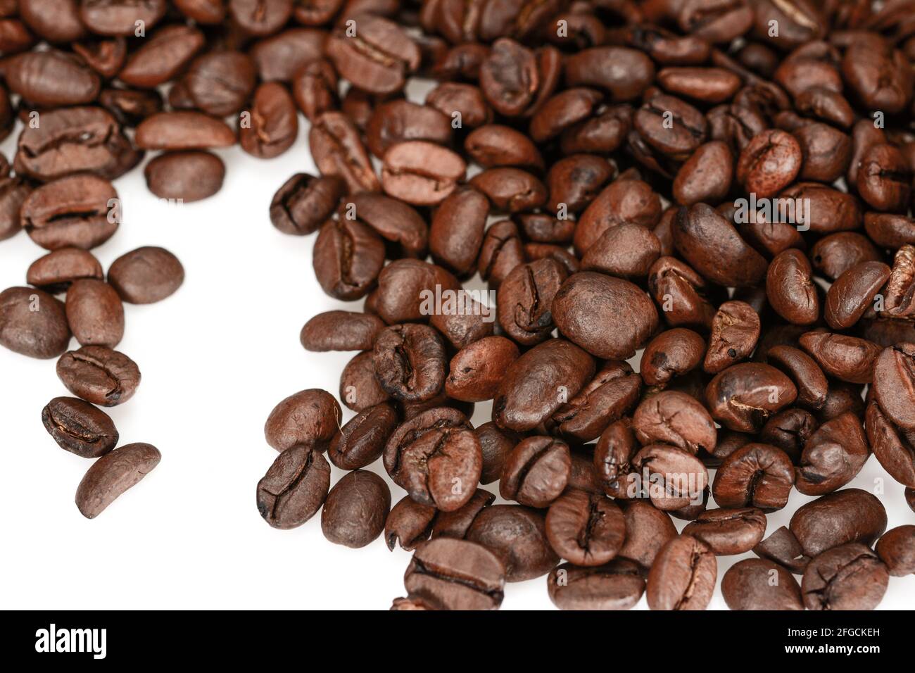 Roasted coffee beans, dark brown, close up isolated on a white ...