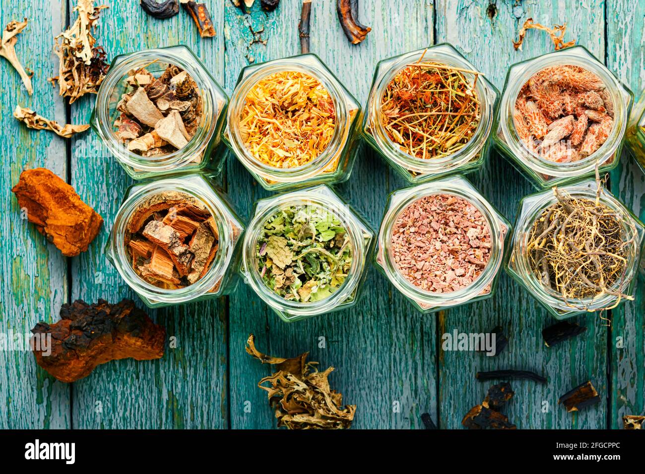 Set of dry medicinal herbs in glass jars.Alternative medicine concept