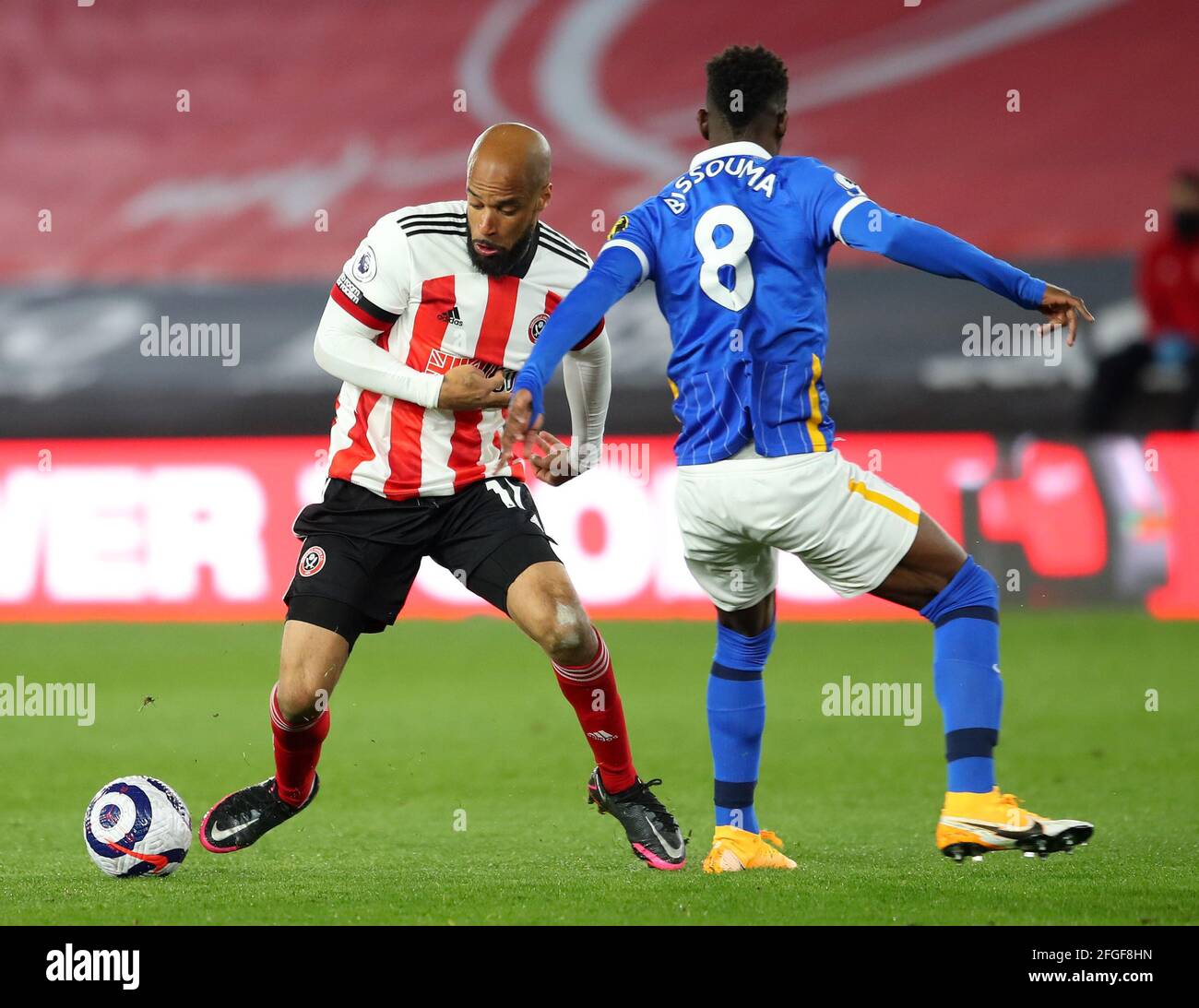 Sheffield, UK. 24th Apr, 2021. David McGoldrick of Sheffield Utd wrong foots Yves Bissouma of Brighton during the Premier League match at Bramall Lane, Sheffield. Picture credit should read: Simon Bellis/Sportimage Credit: Sportimage/Alamy Live News Stock Photo
