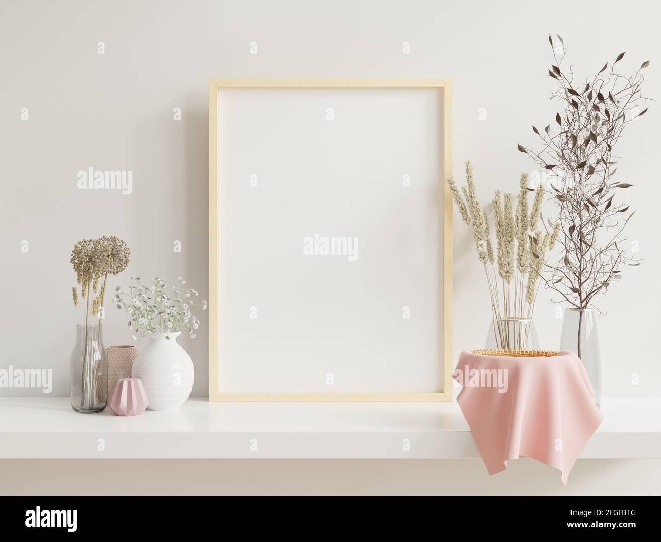 Wooden frame leaning on white shelf in bright interior with plants on ...