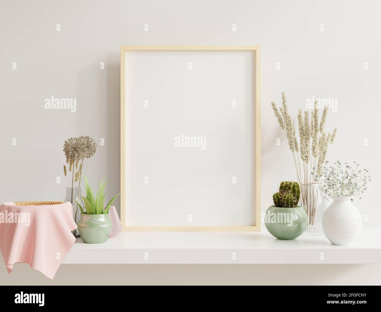 Wooden frame leaning on white shelf in bright interior with plants on ...