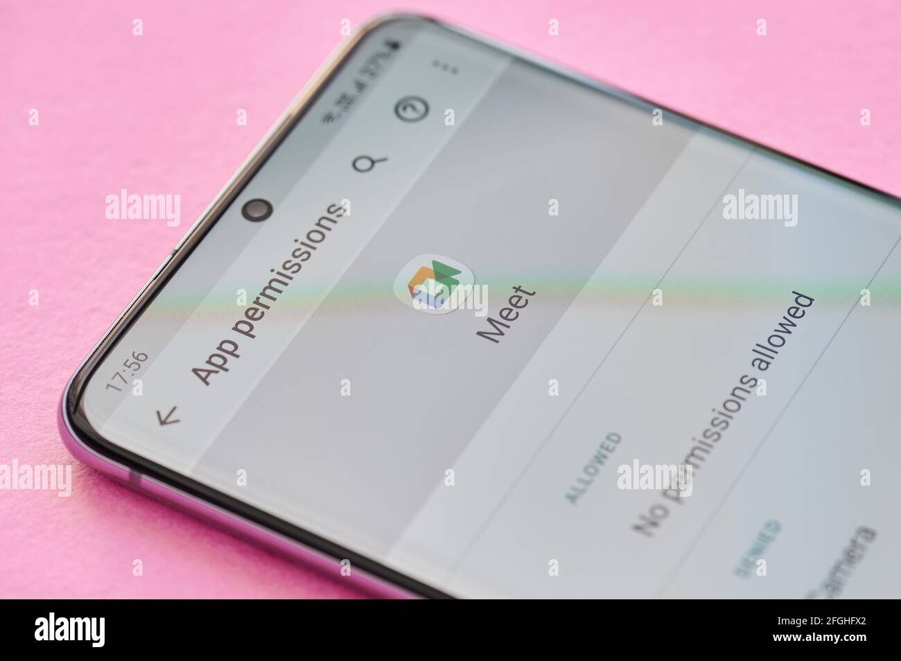 New york, USA - April 23, 2021: Changing permissions setting of google meet app on smartphone screen macro close up view Stock Photo