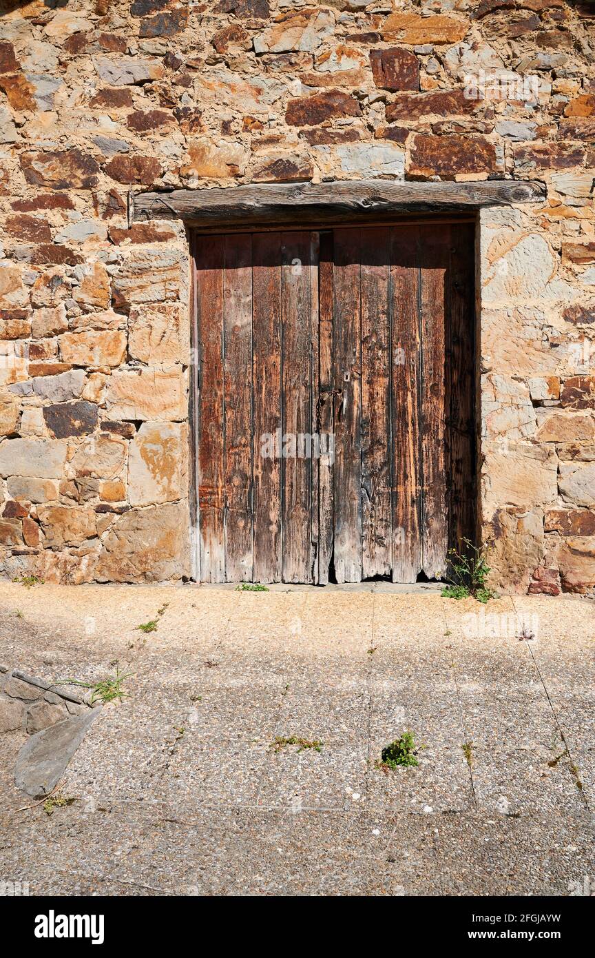 Old wooden door in the stone wall Stock Photo - Alamy