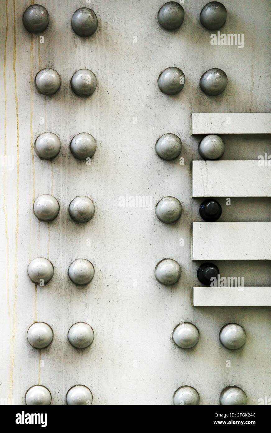 Heavy steel seams secured with rivets Stock Photo
