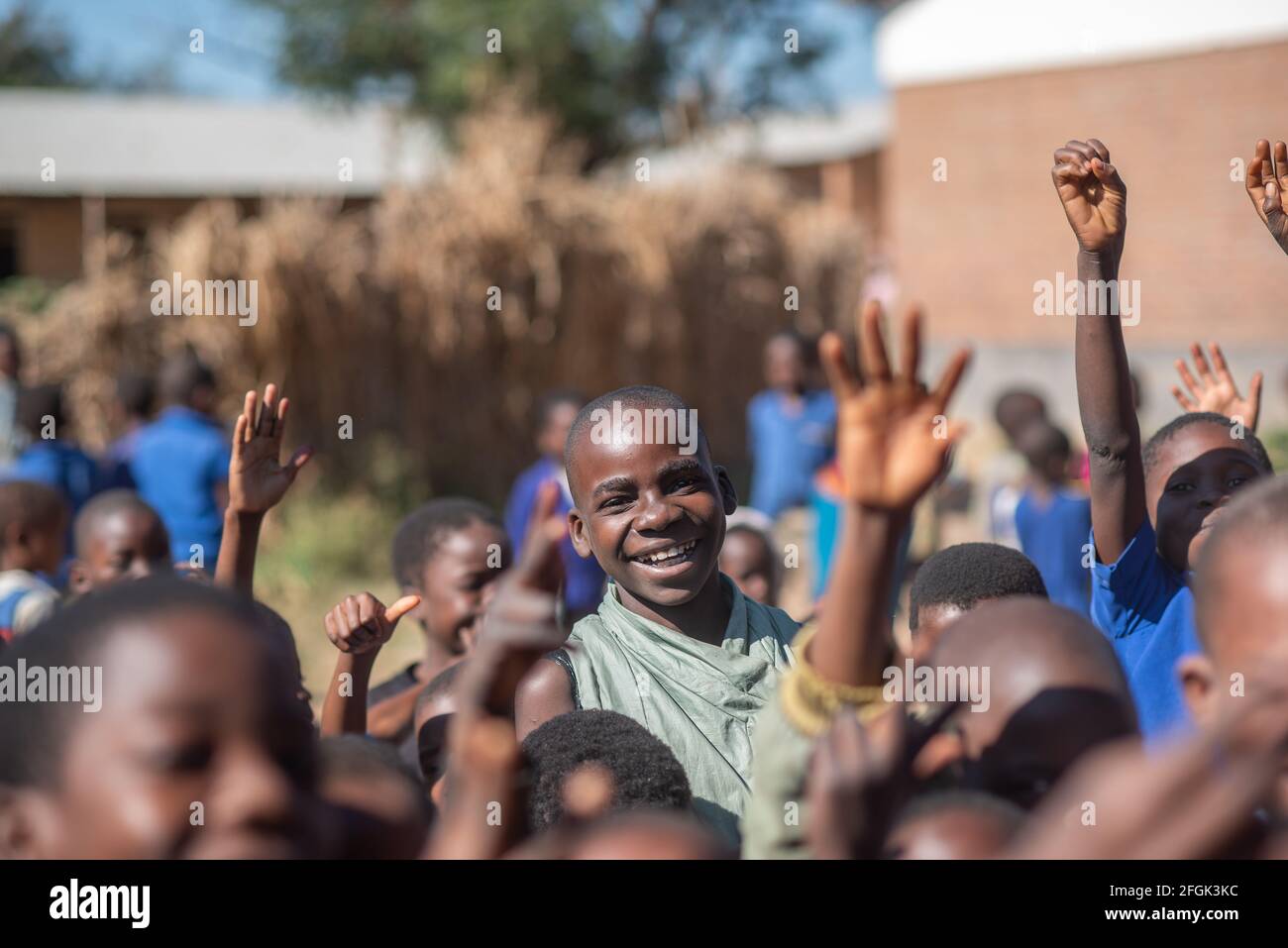Mzuzu, Malawi. 30-05-2018. Portrait of a smiling black boy after finishing the school day before going home in Malawi Stock Photo