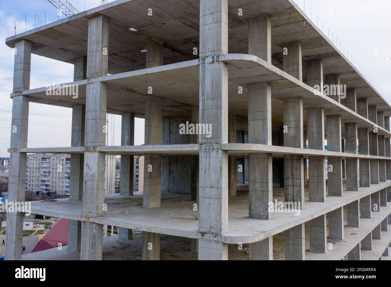 Aerial view of concrete frame of tall apartment building under 