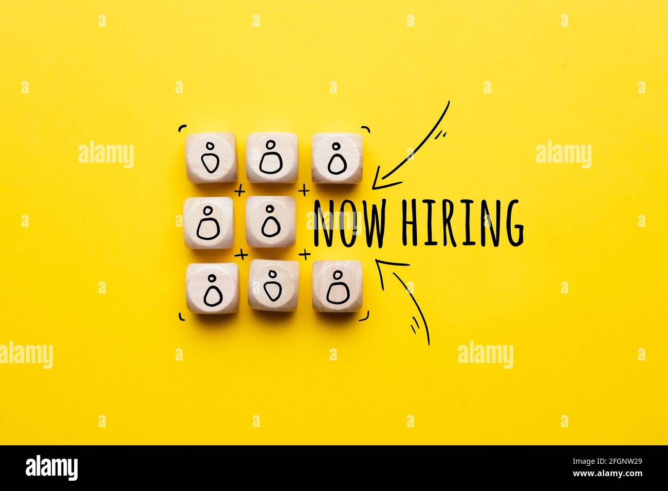 Concept is now hiring. Abstract staff icons on dice Stock Photo Alamy