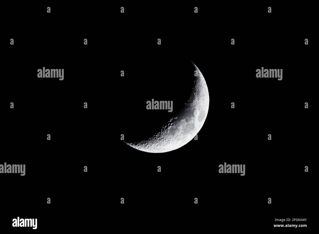 Waxing quarter moon crescent over north London, UK Stock Photo
