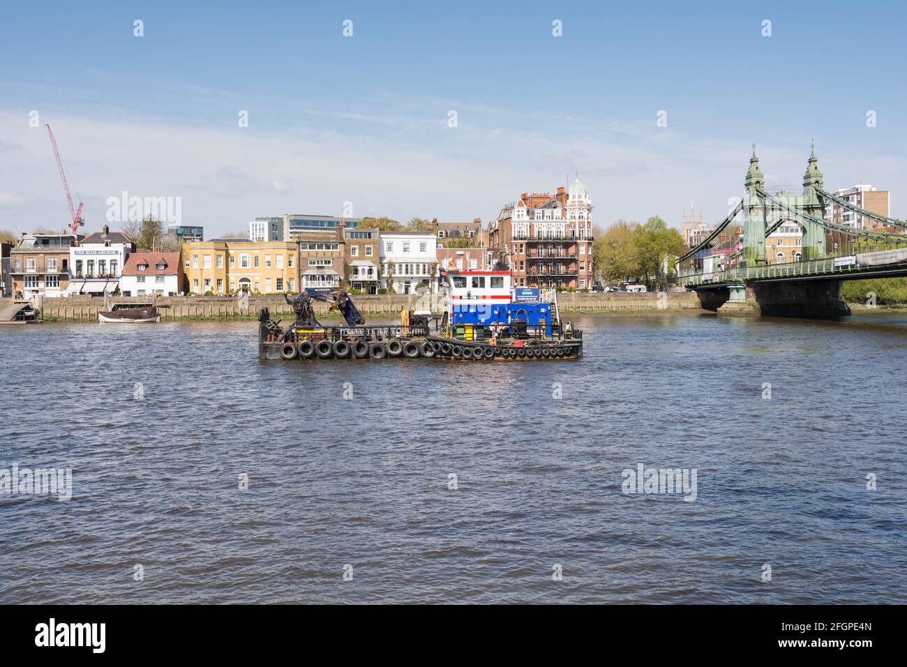 A safety boat stationed upstream from Hammersmith Bridge as it undergoes repairs, Hammersmith
