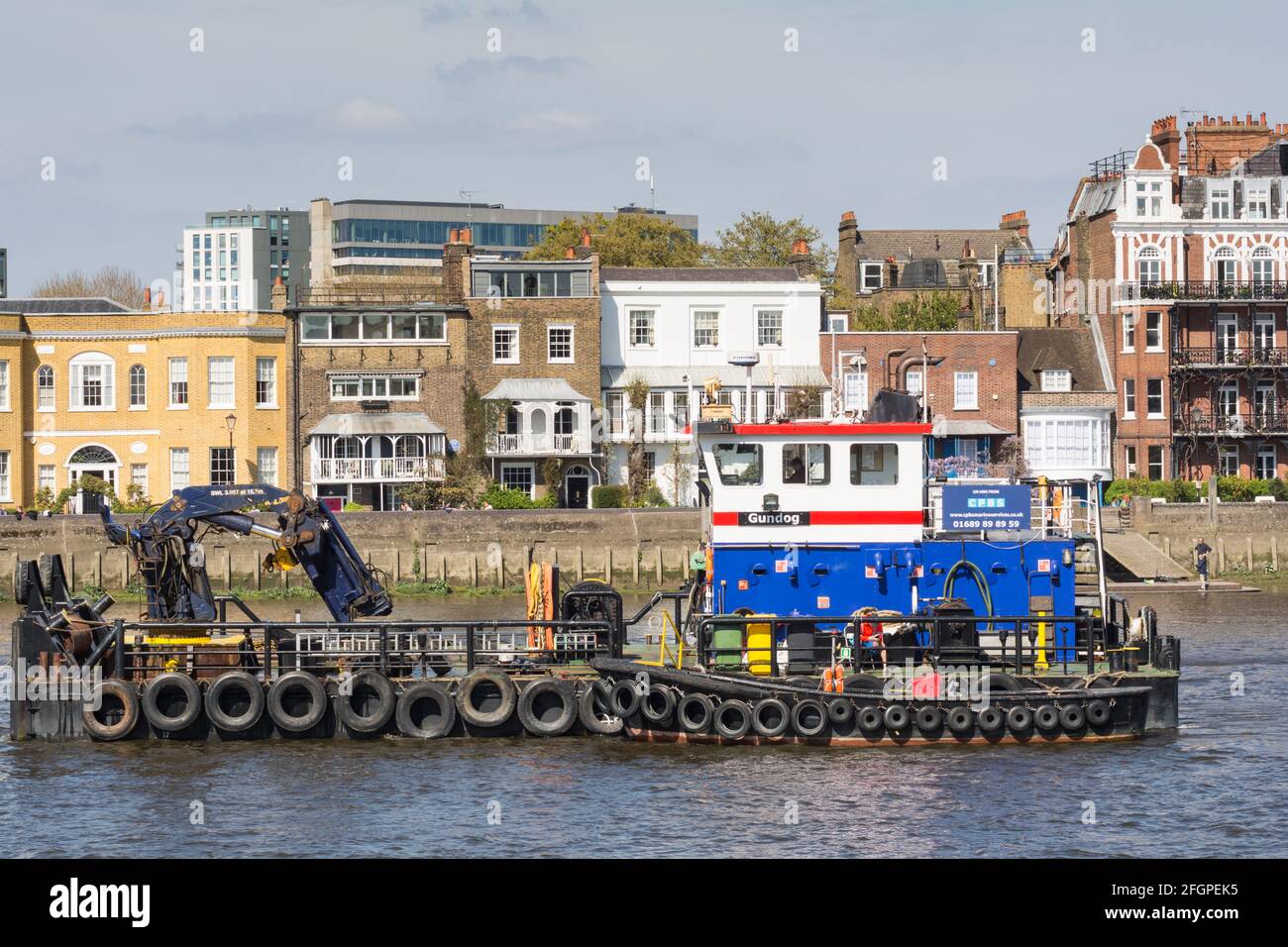 A safety boat stationed upstream from Hammersmith Bridge as it undergoes repairs, Hammersmith