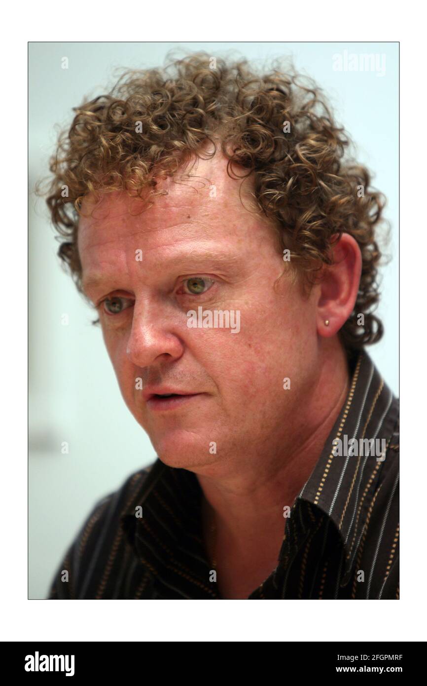 Q Radio.... Paul Rees (short hair, blue top) Editor of Q magazine and Rick  Blaxill (curly hair, brown top) Program Director Q  by  David Sandison The Independent Stock Photo - Alamy