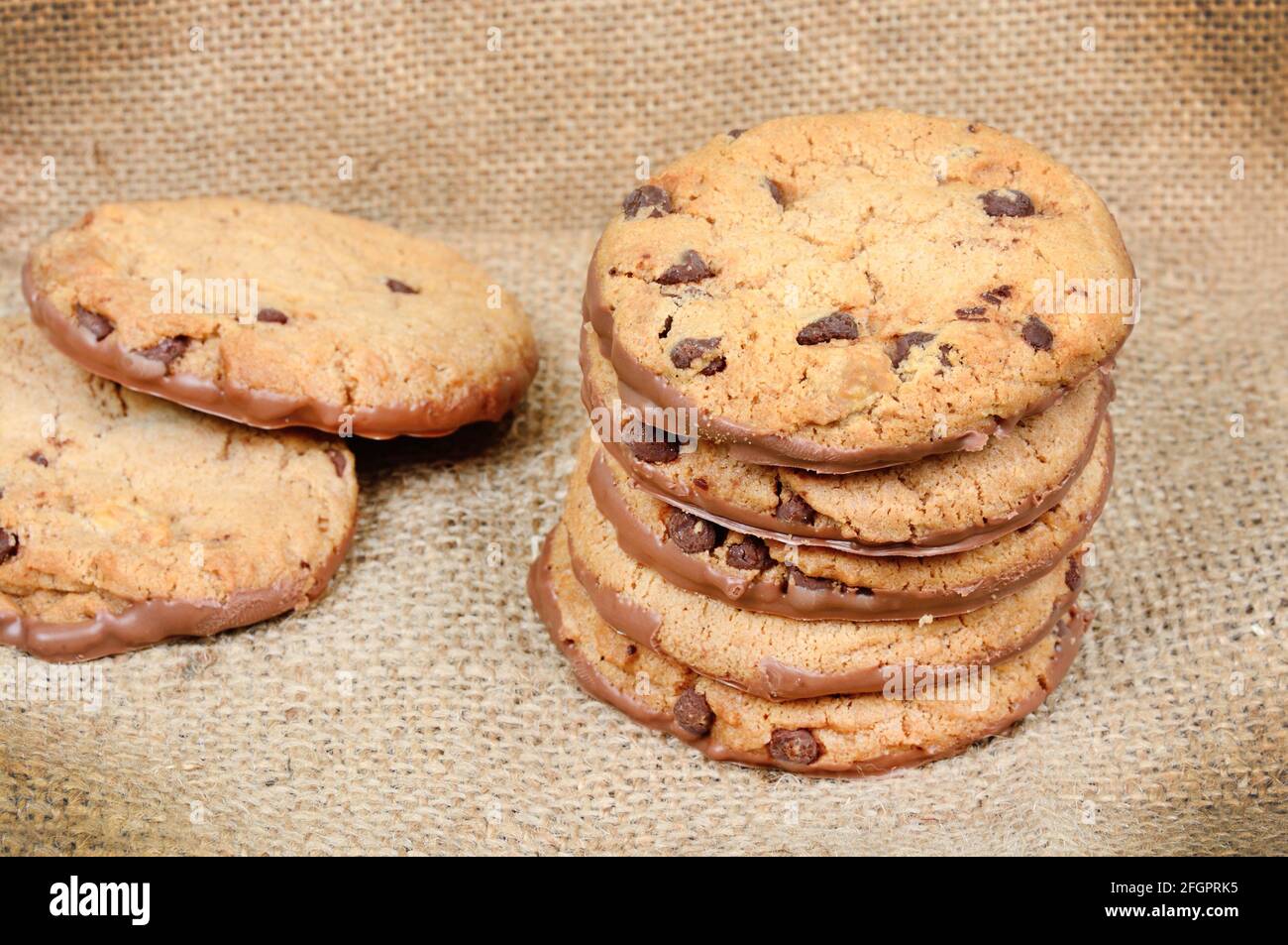 Grouo of chocolate cookies on a jute canvas close up Stock Photo