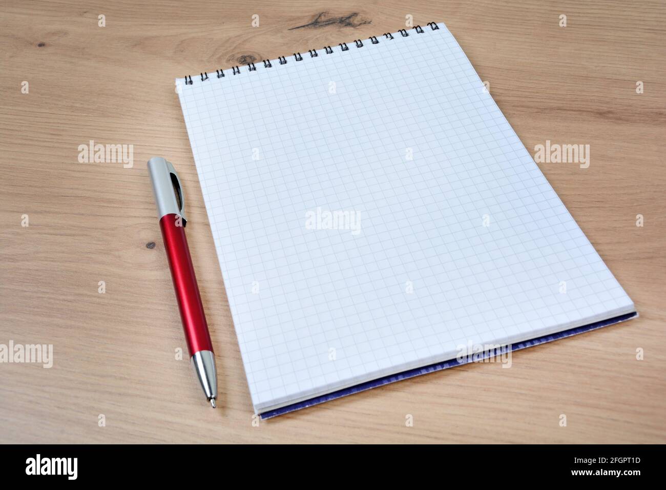 Empty notebook with pen on a wood table Stock Photo