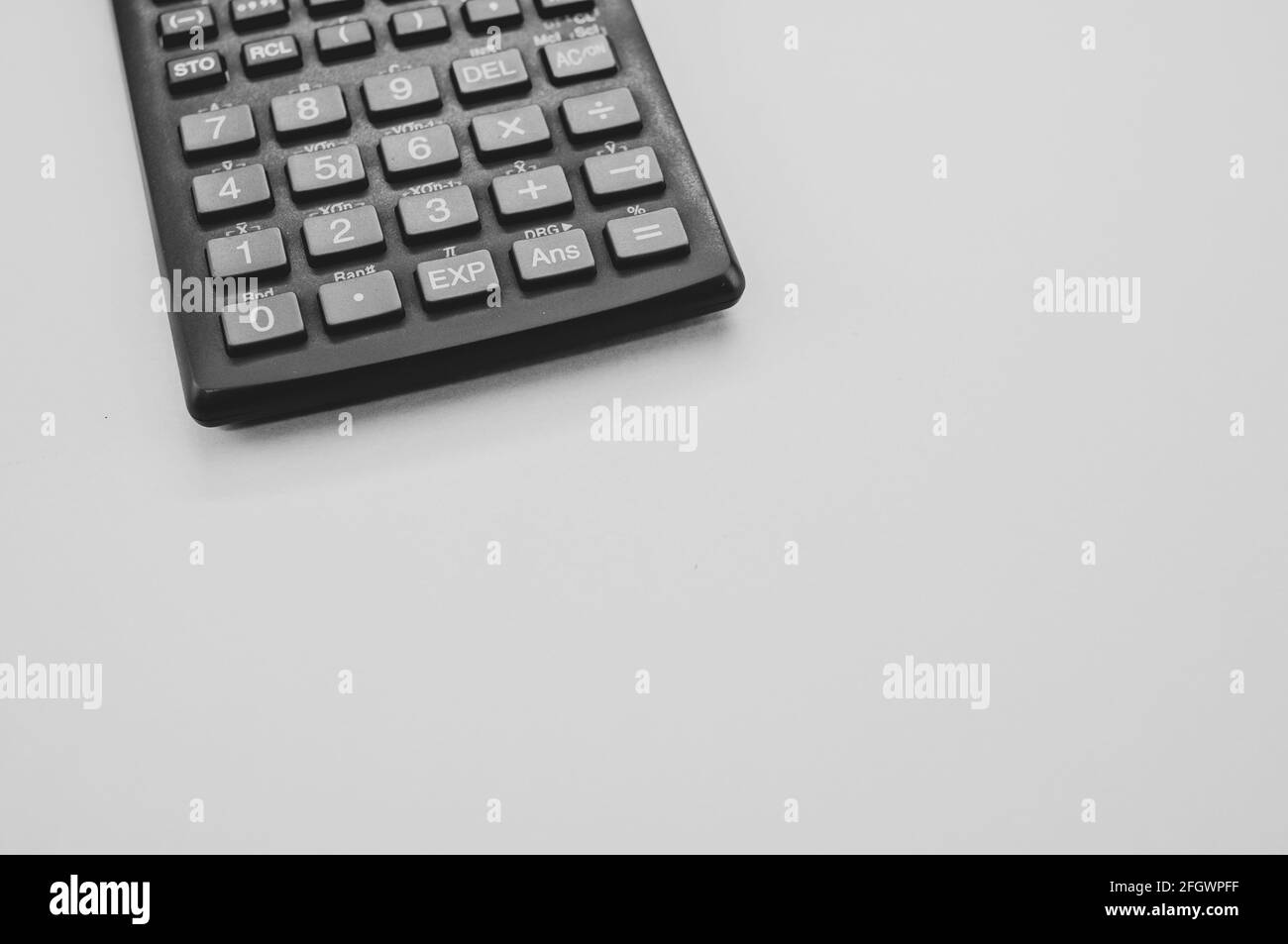 Calculating with calculator Black and White Stock Photos & Images - Alamy