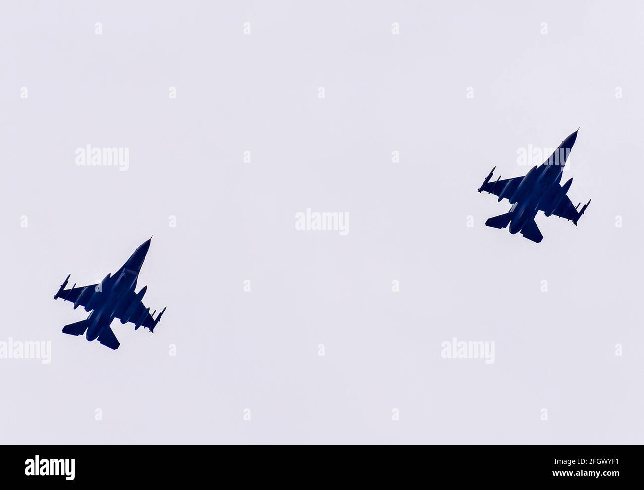 F15 fighter jets pass over a suburban house Stock Photo