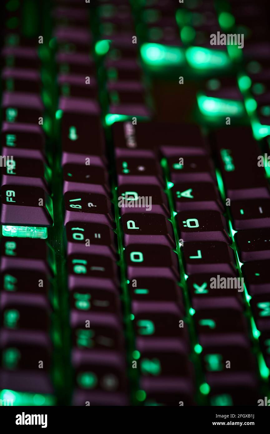 View to parts of an illuminated computer keyboard in the dark Stock ...