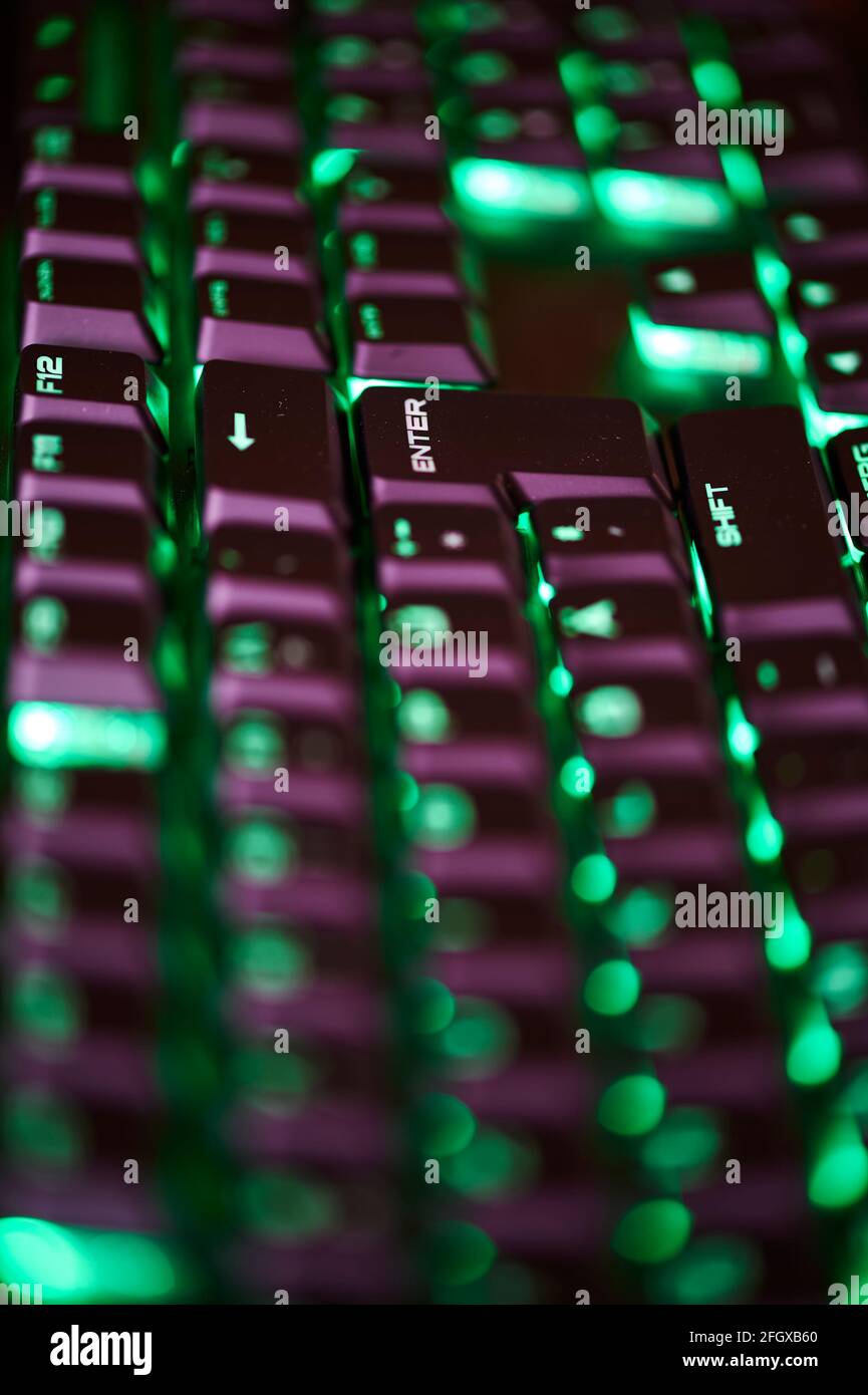 View to parts of an illuminated computer keyboard in the dark Stock ...