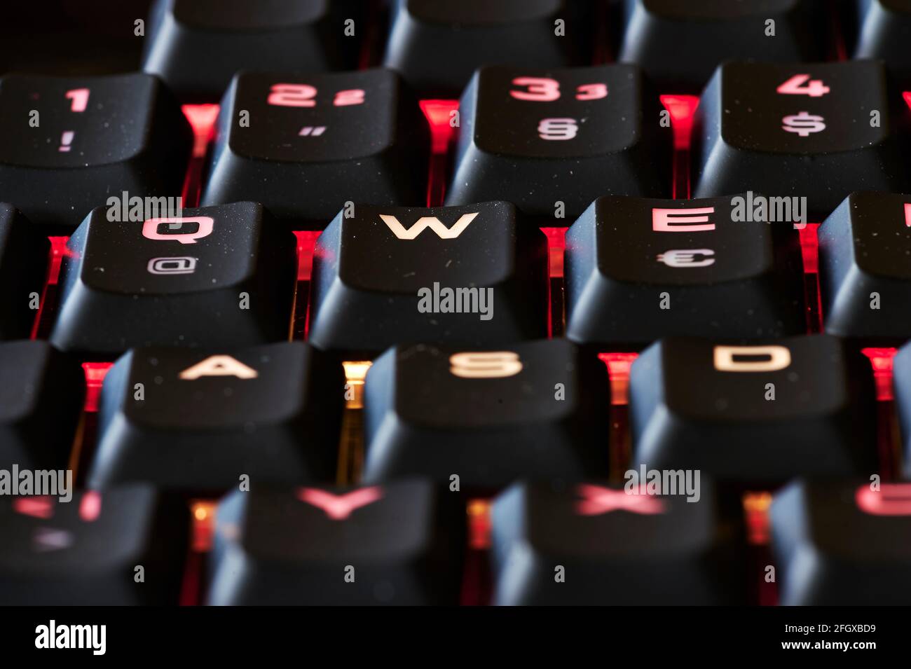 View to parts of an illuminated computer keyboard in the dark Stock ...