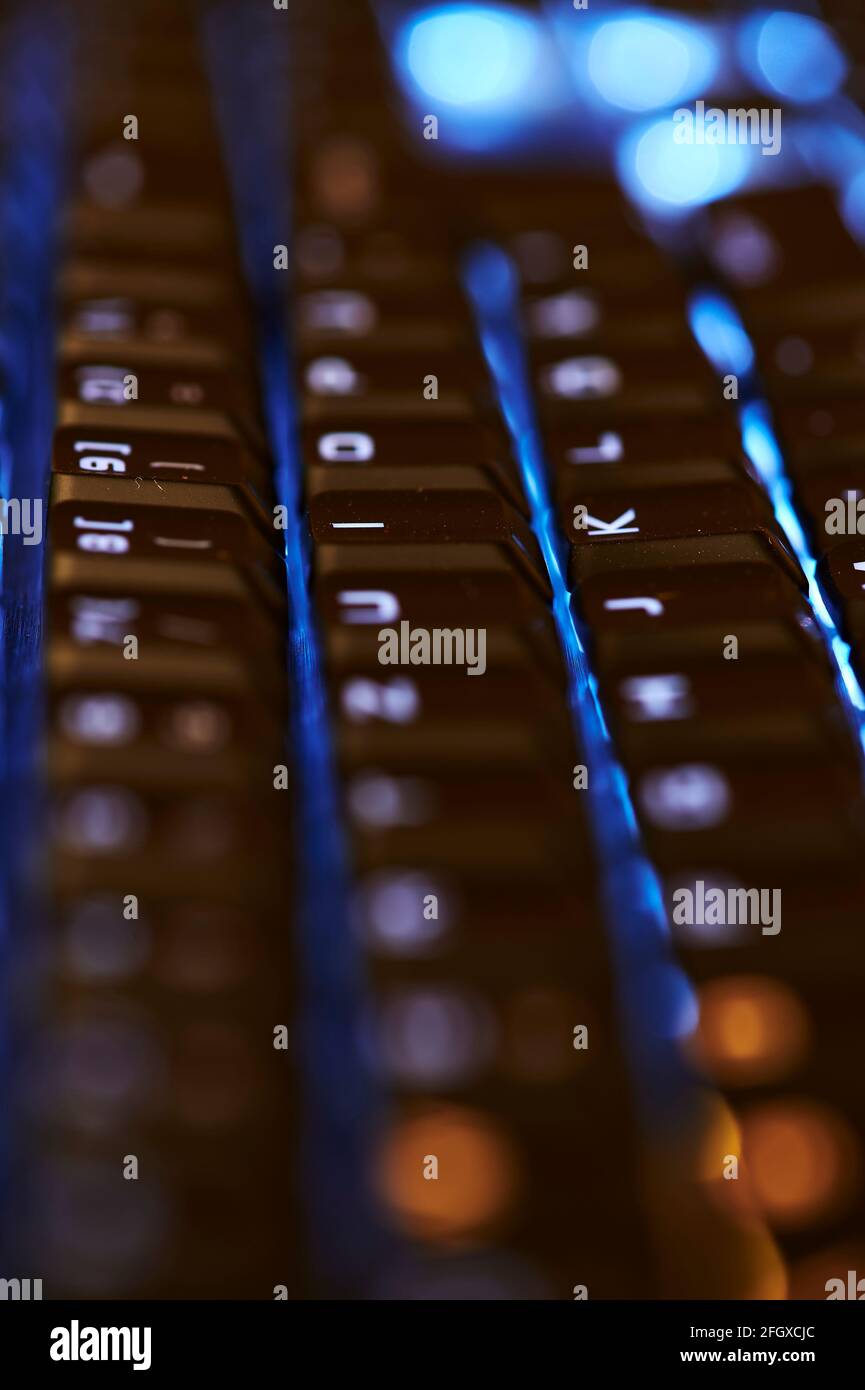 View to parts of an illuminated computer keyboard in the dark Stock ...