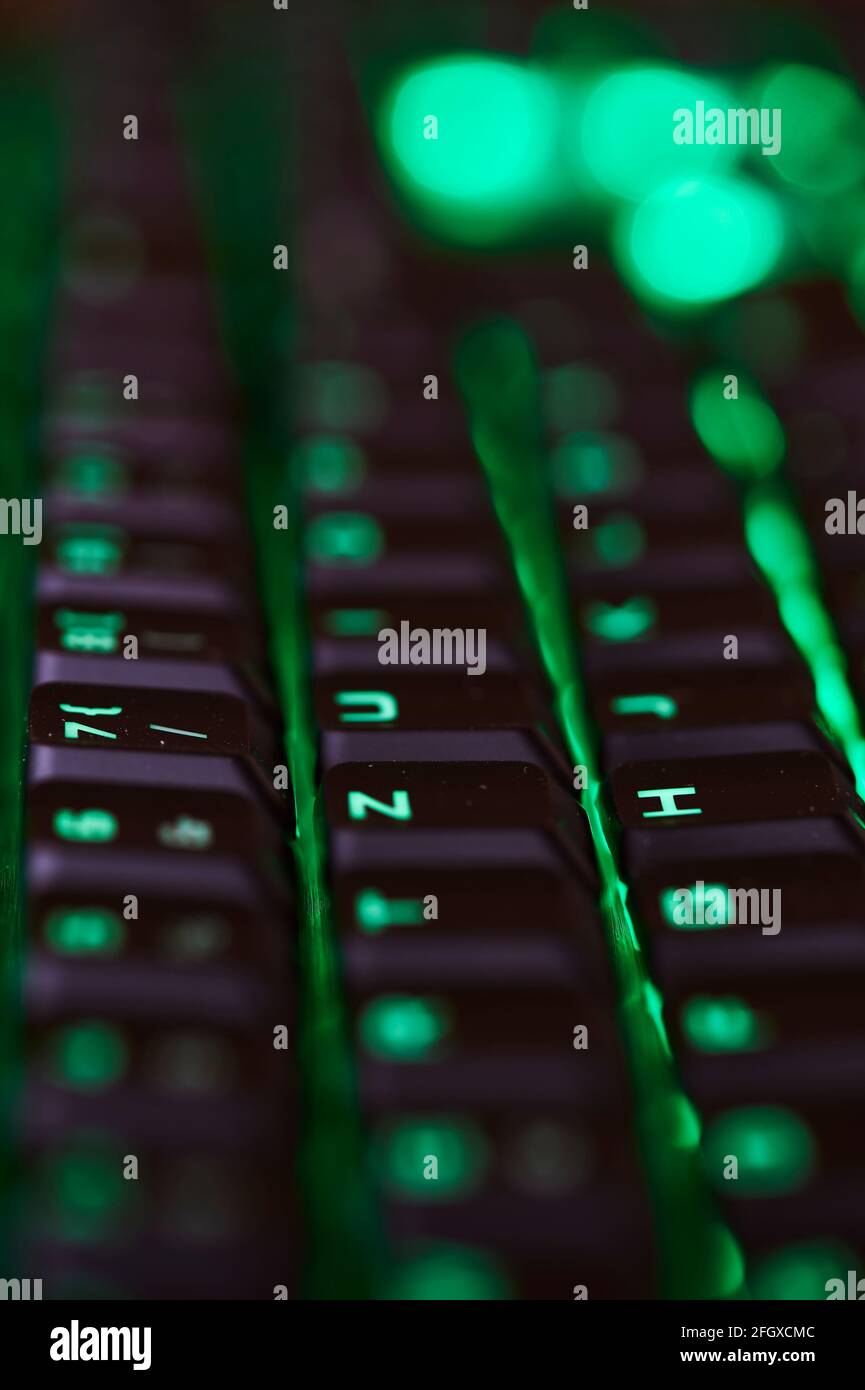 View to parts of an illuminated computer keyboard in the dark Stock ...