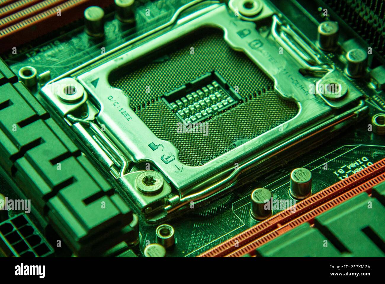 Detail of a Cpu socket in a motherboard of a gaming pc in green light Stock Photo Alamy