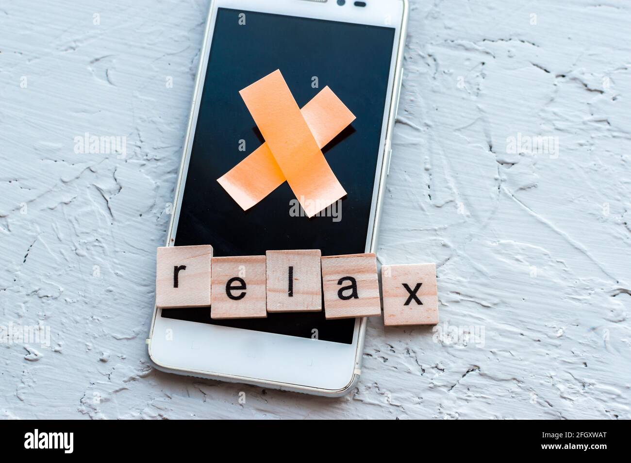 Concept digital detox. Turned off mobile phone and the inscription ...