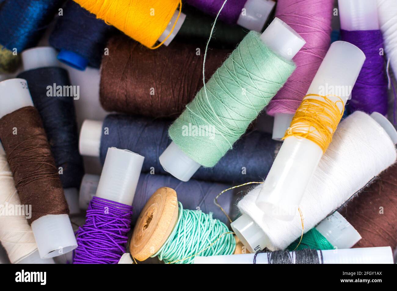 Spools of colored threads close up. Handcraft concept. Stock Photo