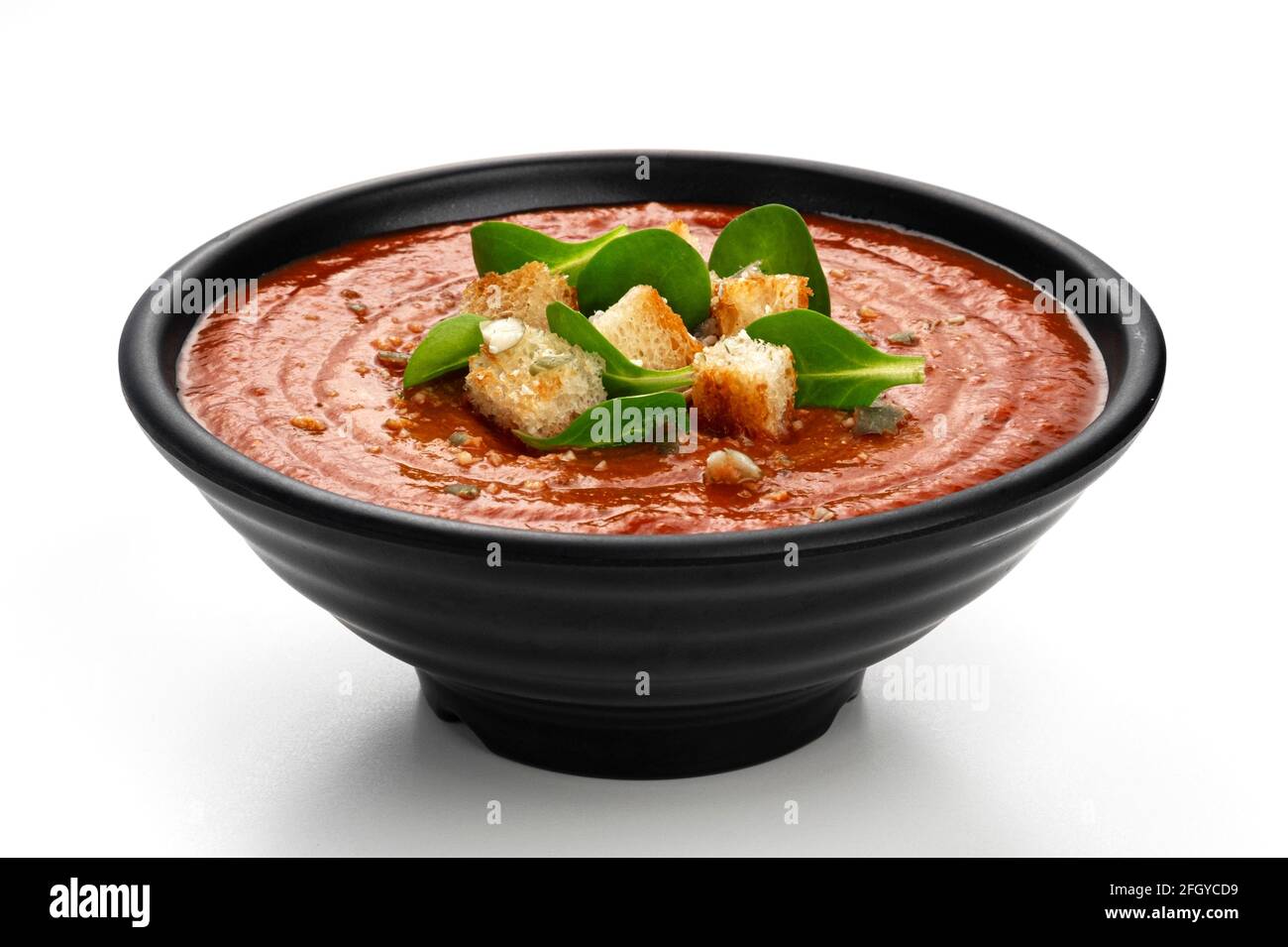 Bowl of tomato soup isolated on white background Stock Photo - Alamy