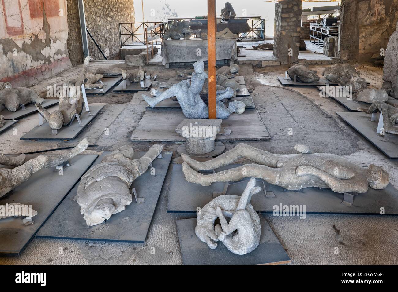 Human bodies plaster cast, ancient victims of the Mount Vesuvius volcano eruption in AD 79, Mensa Ponderaria in Pompeii, Italy Stock Photo