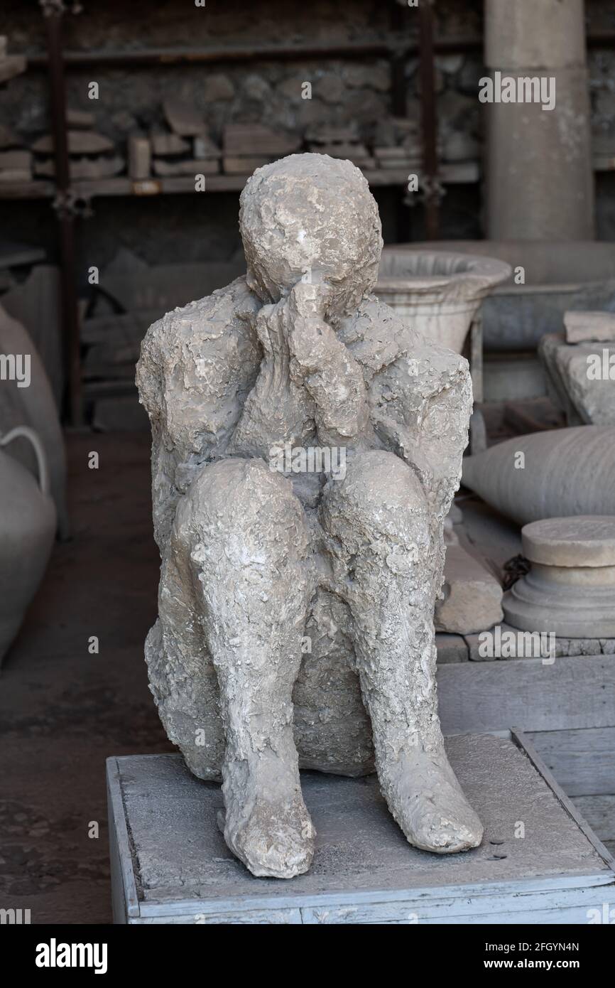 Human body plaster cast, ancient victim of the Vesuvius volcano eruption at Mensa Ponderaria in Pompeii, Italy Stock Photo