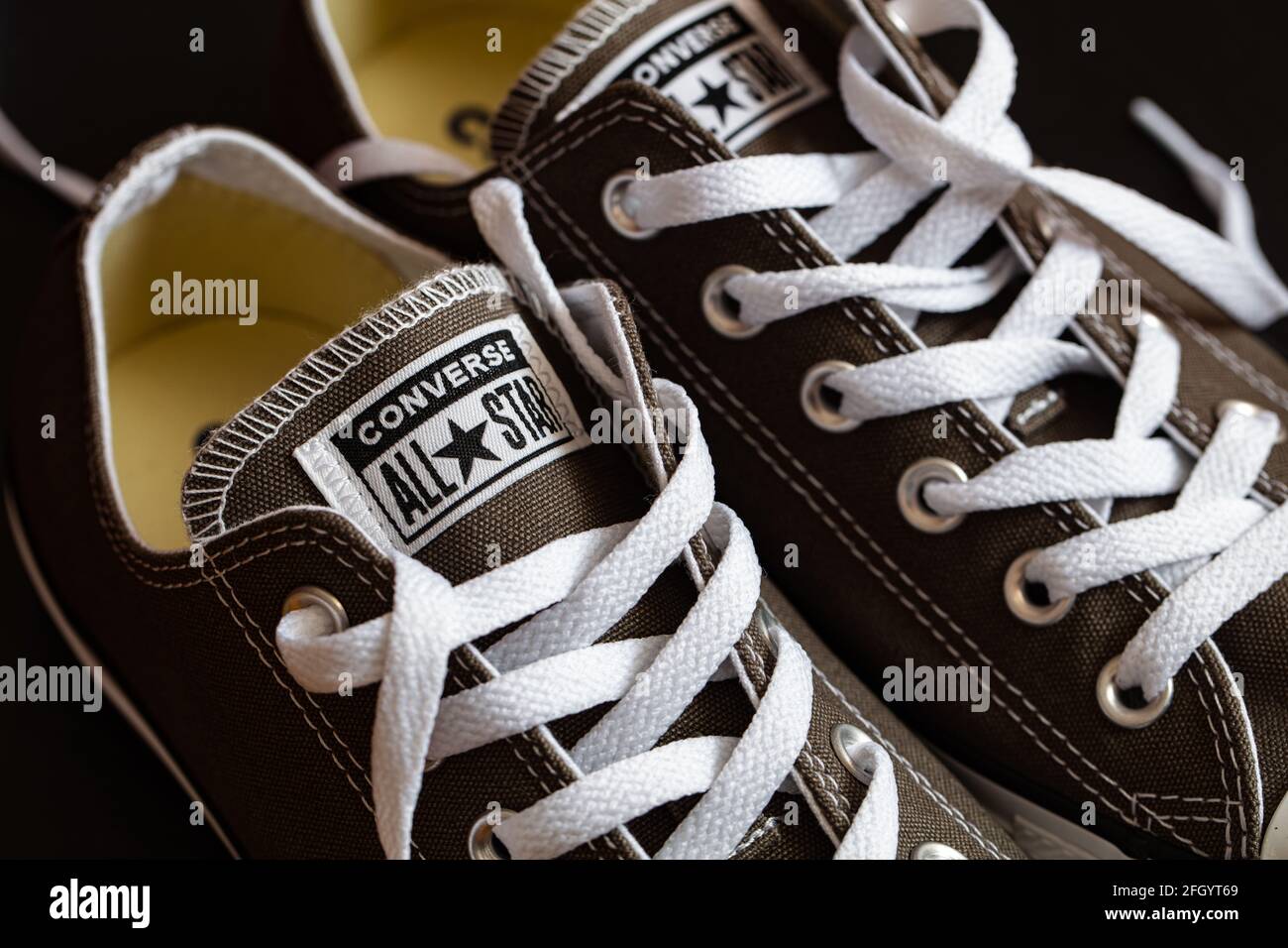 gradvist banjo Gå til kredsløbet Lviv, Ukraine - April 9, 2021: Grey Converse All Star shoes on black  background Stock Photo - Alamy