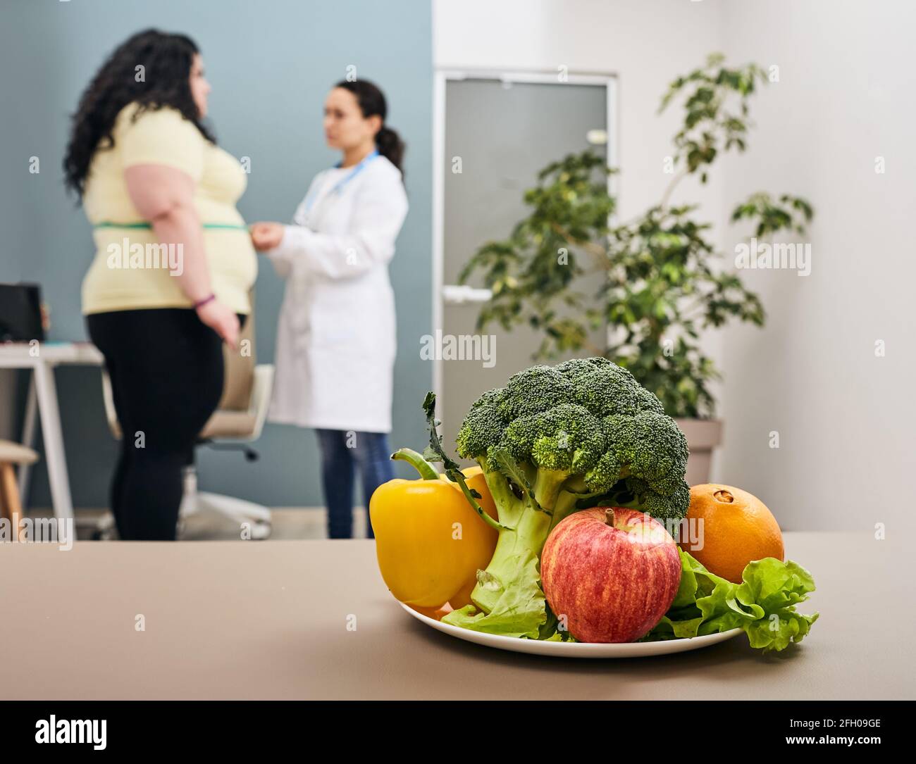 Weight loss. Nutritionist measures a body mass index of an oversize
