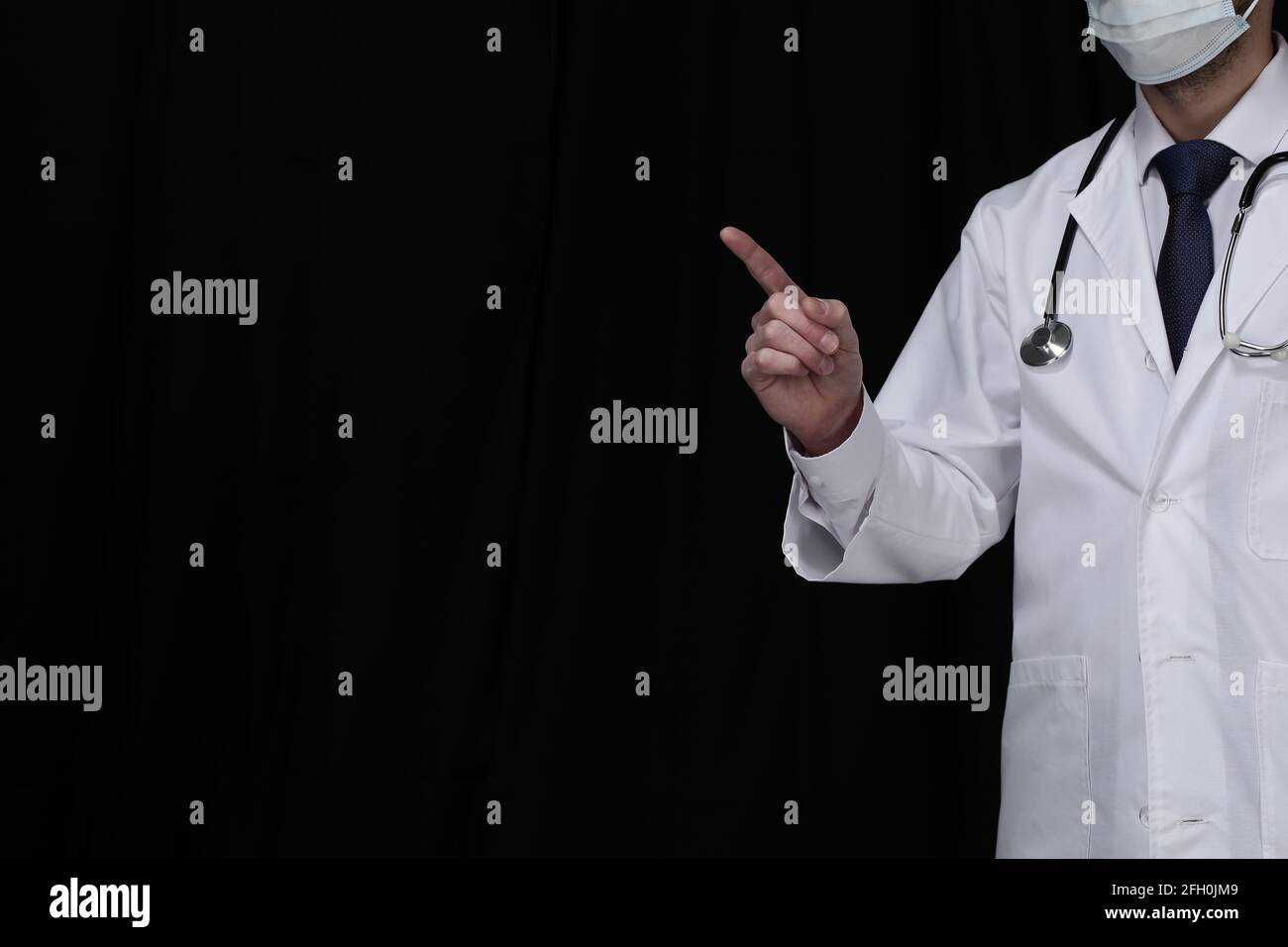 Doctor with stethoscope on black background Stock Photo