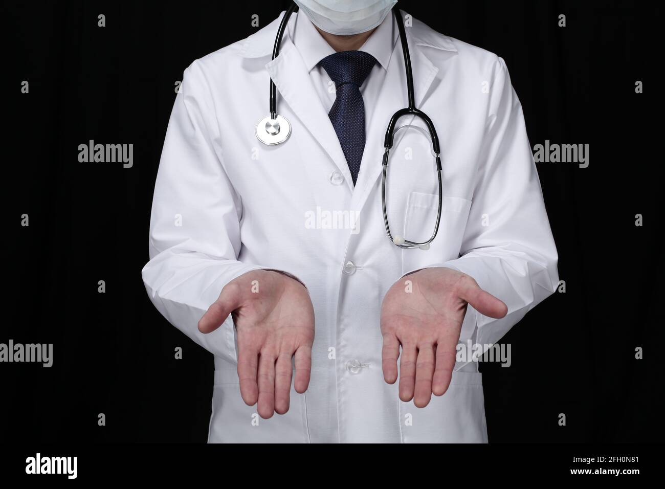 Doctor with stethoscope on black background Stock Photo