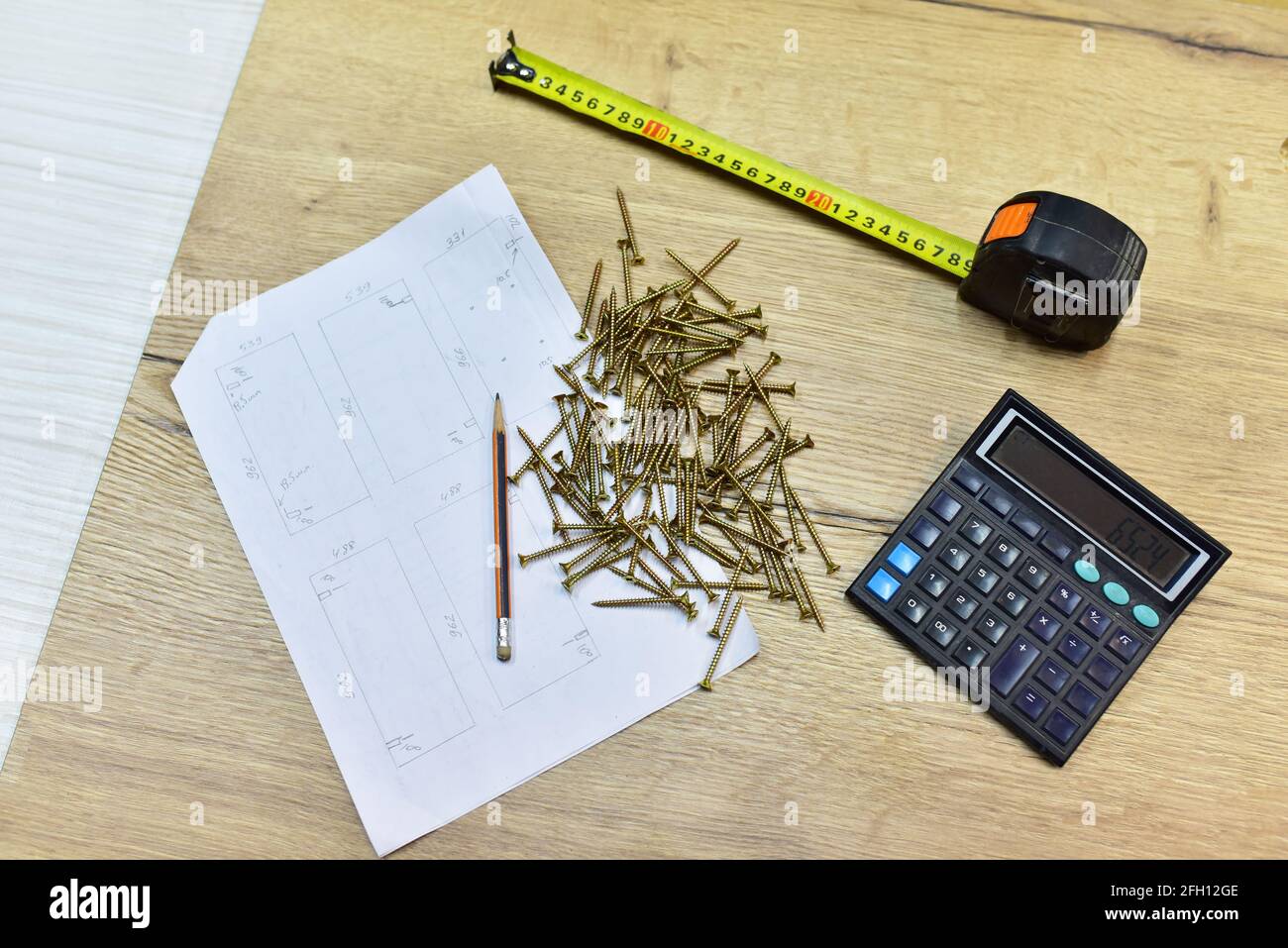 Construction Measuring Tape, Calculator and Selftapping screws for