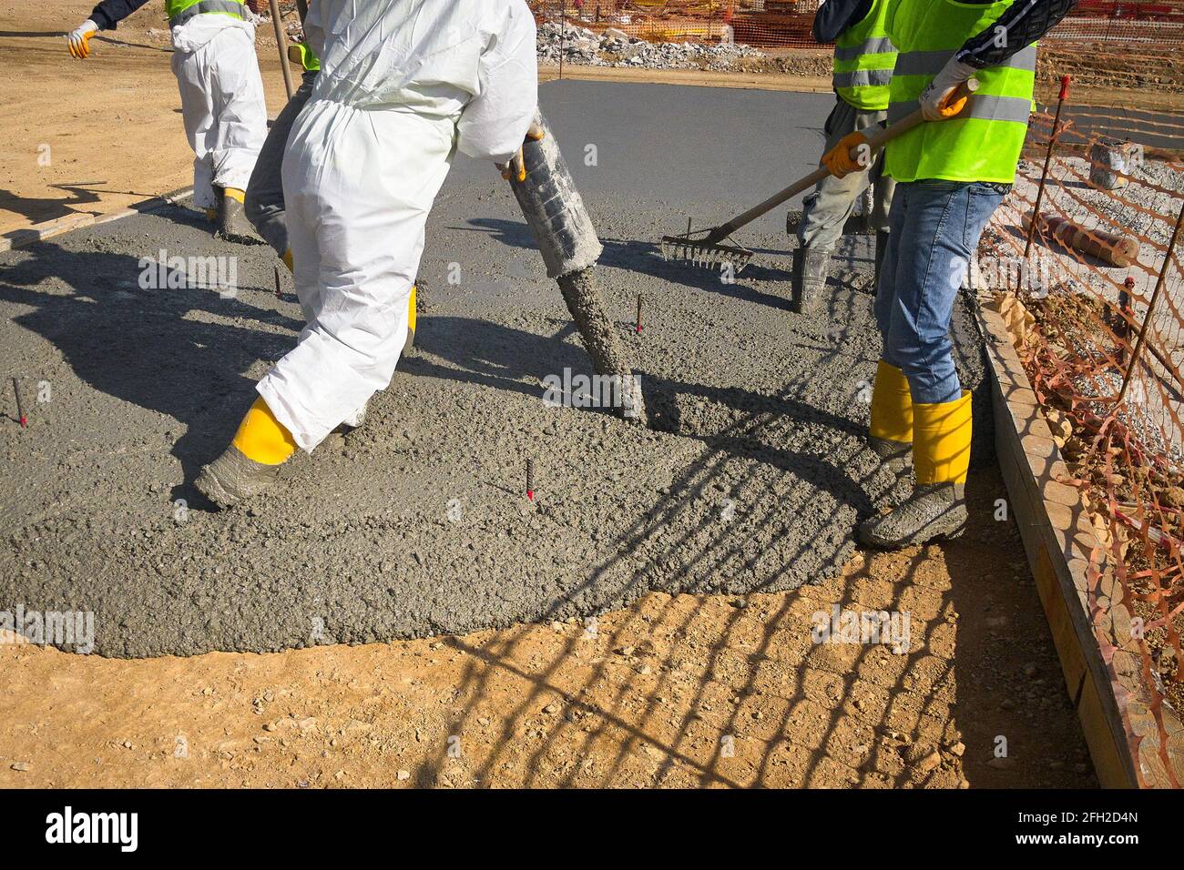 Construction workers pour a concrete Stock Photo
