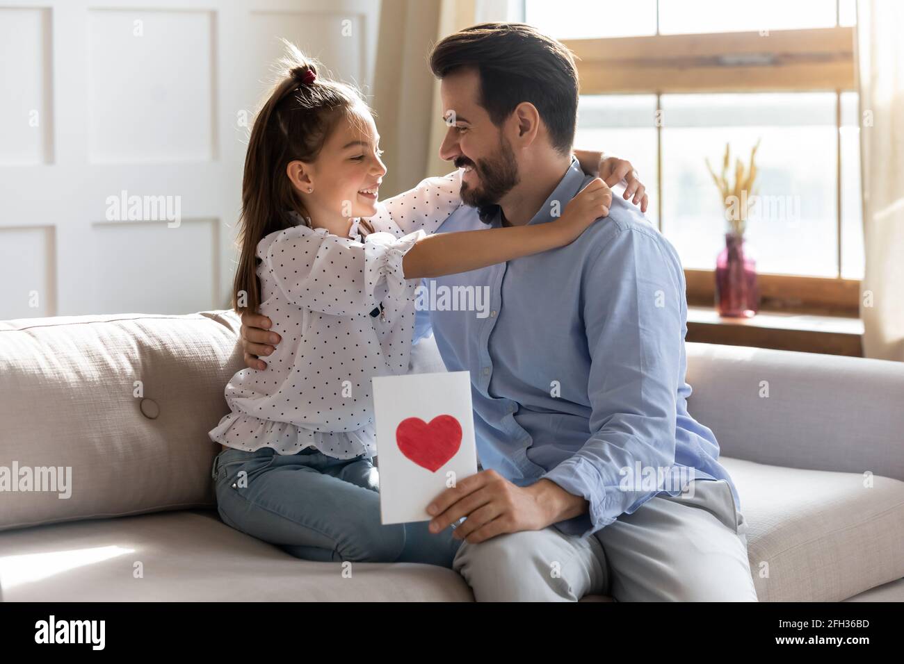 Happy teen daughter congratulate dad with birthday Stock Photo