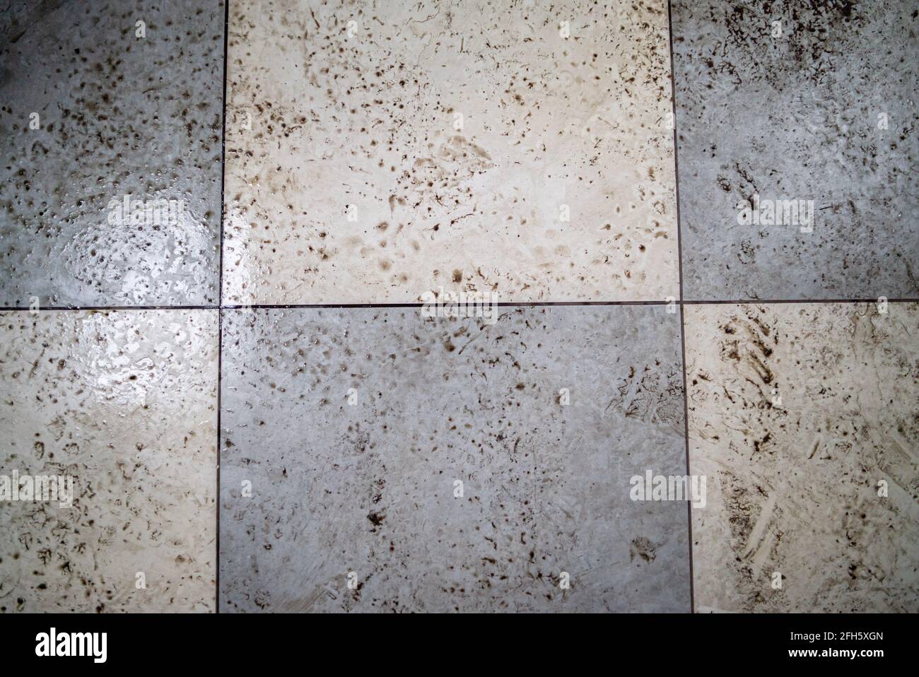 Wet and dirty checkered ceramic floor Stock Photo