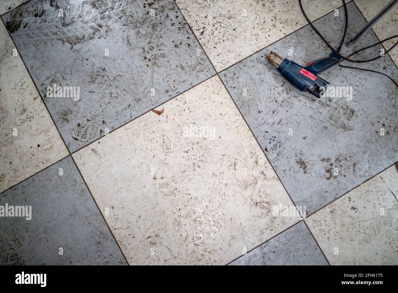 Wet and dirty checkered ceramic floor Stock Photo