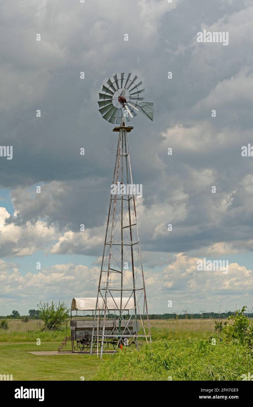 Working Windmill Against the Sky in Goose Lake Prairie State Natural Area in Illinois Stock Photo