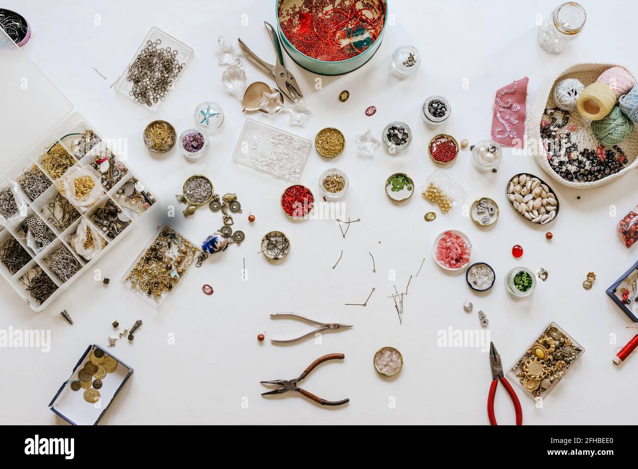 Top view of assorted beads instruments and threads with various bugle and spangle for creating accessories Stock Photo