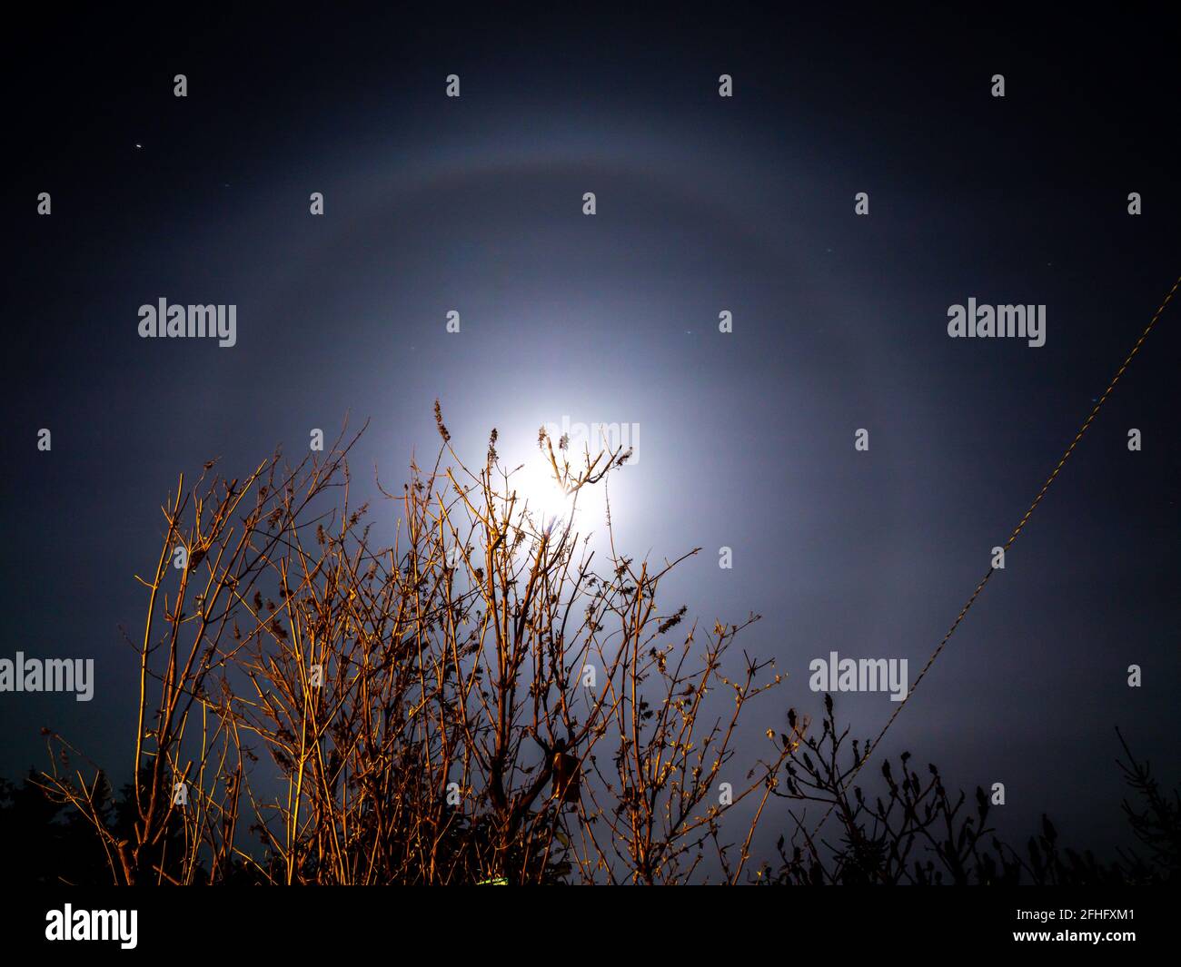 Halo ring of light around the moon Stock Photo Alamy