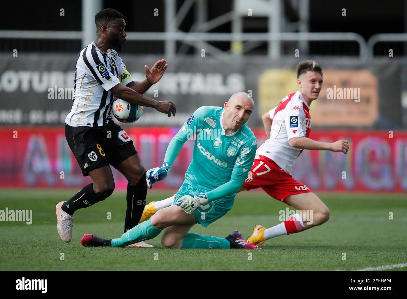 Soccer Football - Ligue 1 - Angers v AS Monaco - Stade Raymond Kopa, Angers,  France - April 25, 2021 AS Monaco's Aleksandr Golovin in action with Angers'  Paul Bernardoni REUTERS/Stephane Mahe Stock Photo - Alamy