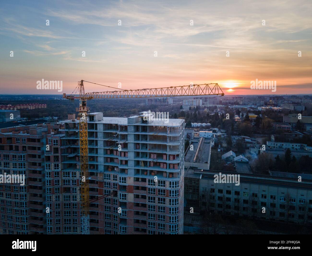 aerial view of apartment construction site with crane city development ...