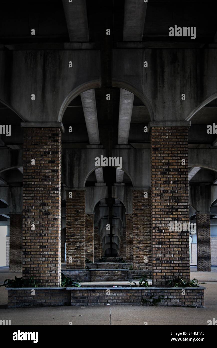 old concrete and brick in diminishing perspective beneath the causeway Stock Photo