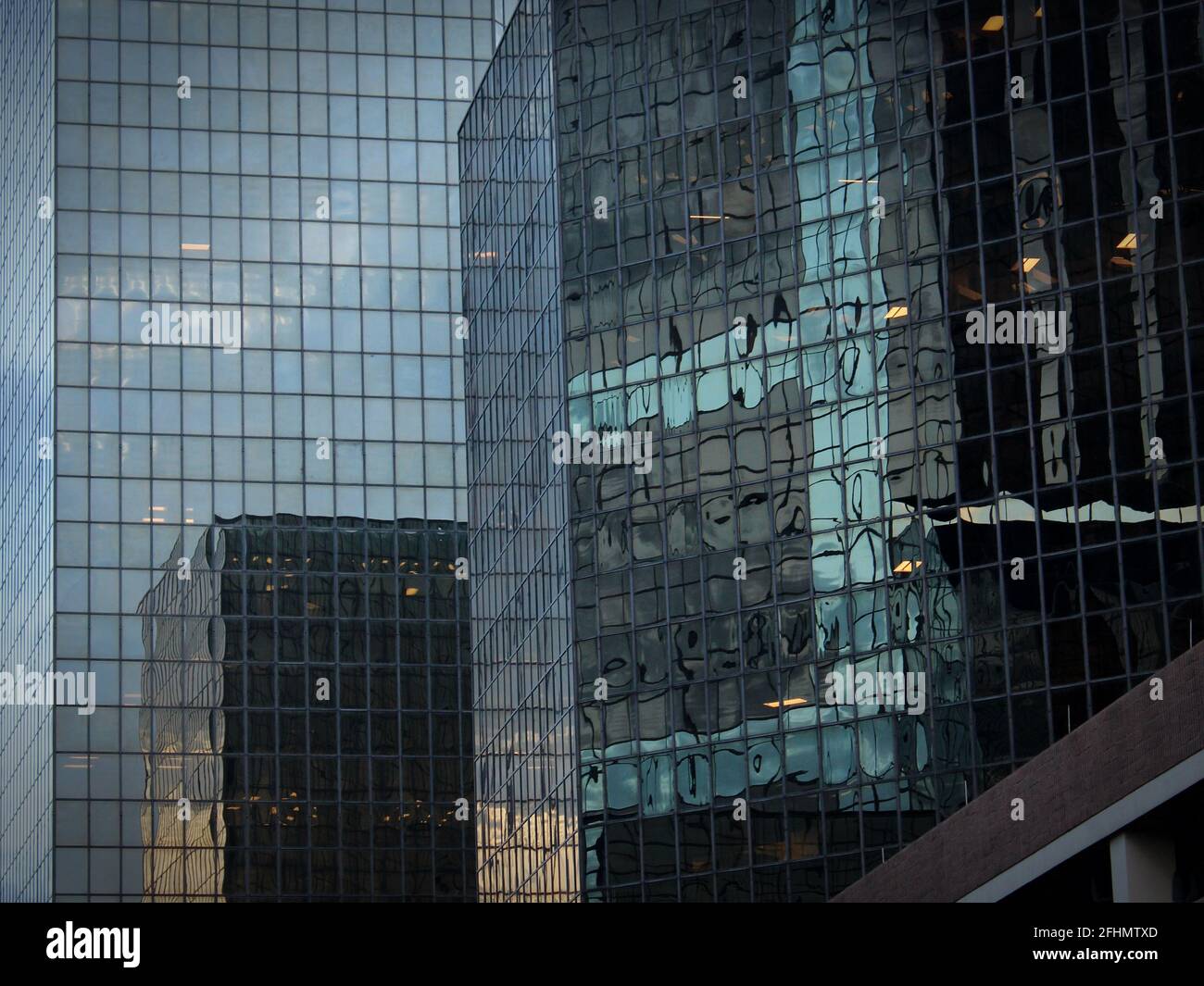 glass and steel buildings reflected upon each other Stock Photo