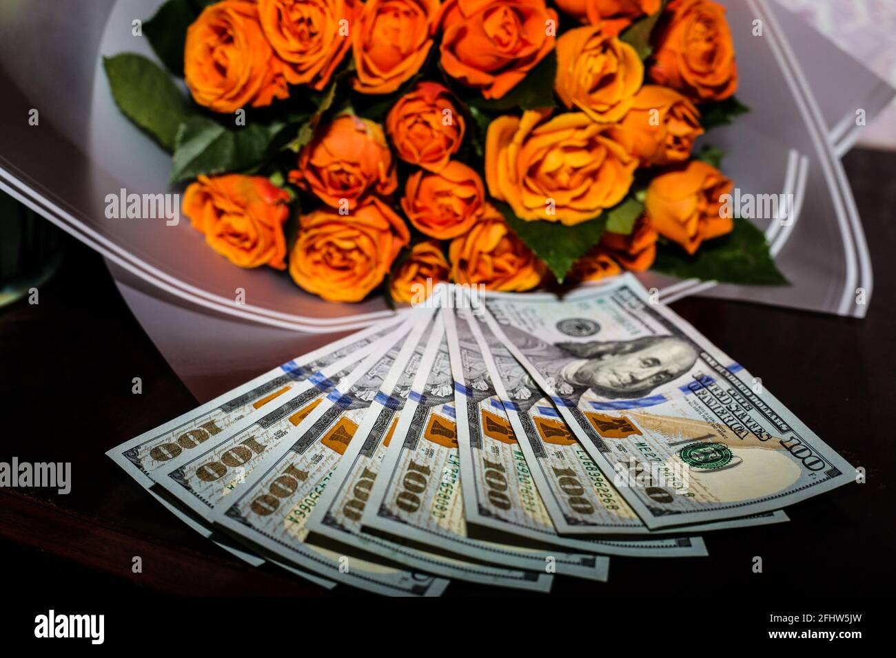 money the best decoration for a girl is money and flowers Stock Photo