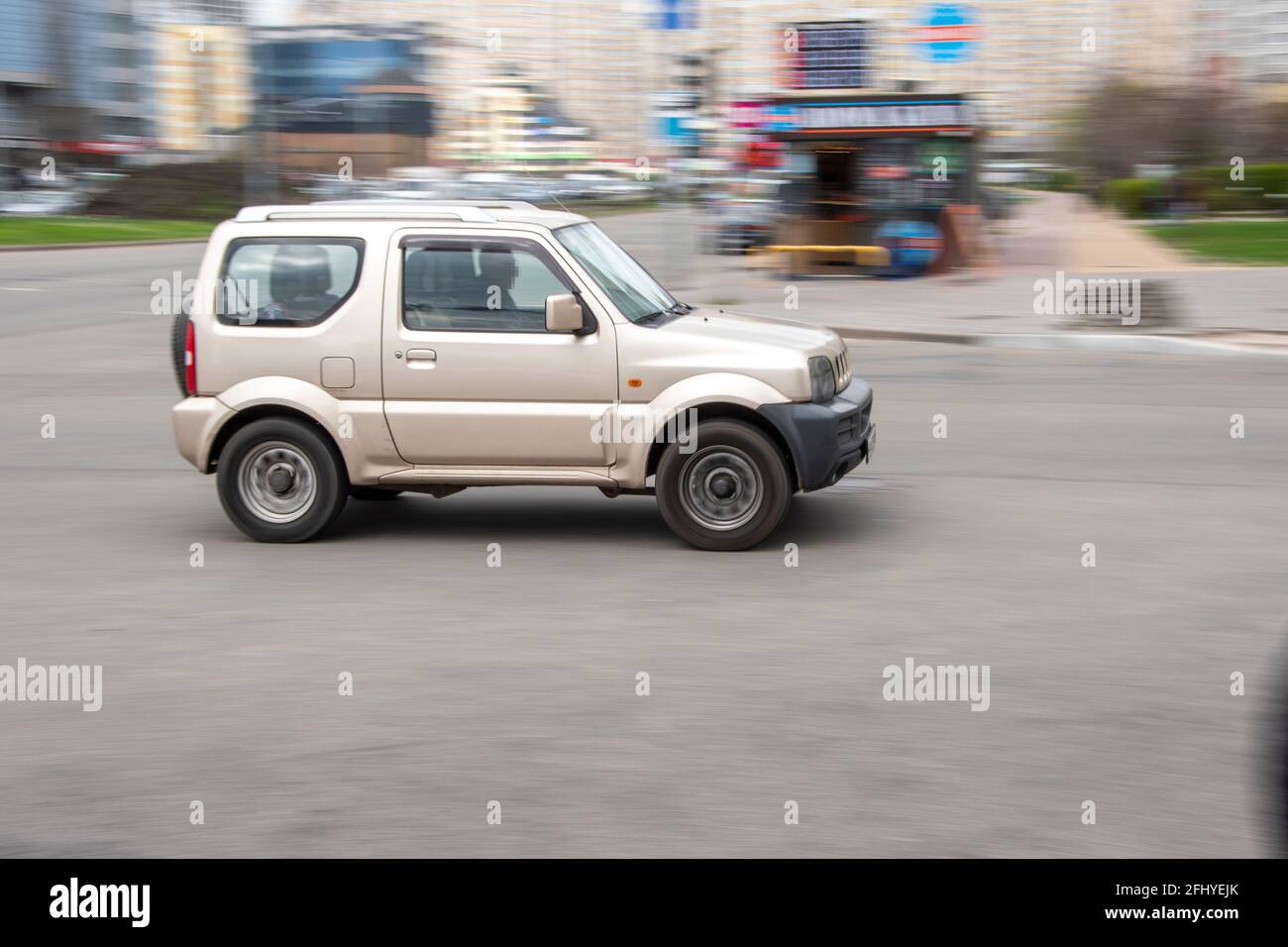 Ukraine, Kyiv - 20 April 2021: Silver Suzuki Jimny car moving on the street. Editorial Stock Photo